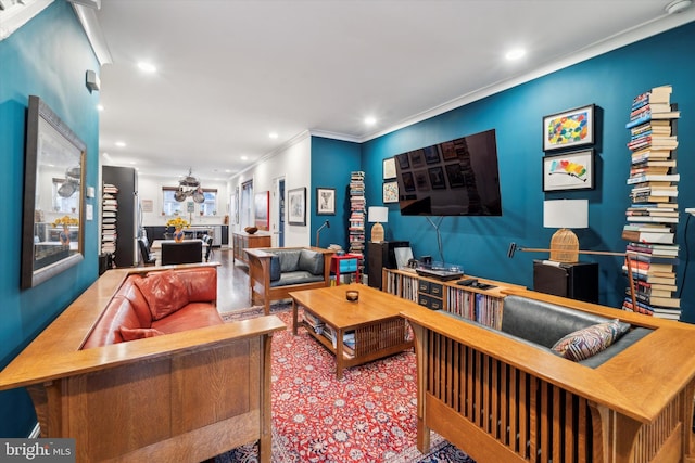 living area featuring recessed lighting and crown molding