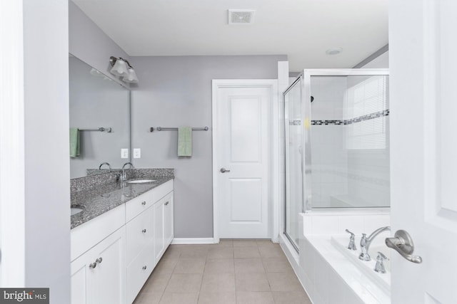 bathroom with tile patterned flooring, a sink, visible vents, double vanity, and a stall shower