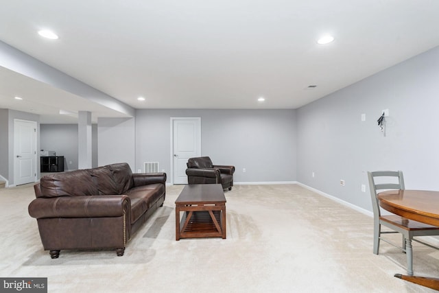 living area featuring light carpet, visible vents, baseboards, and recessed lighting