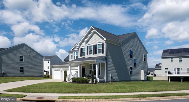 view of front of property featuring a garage, a front yard, covered porch, and driveway
