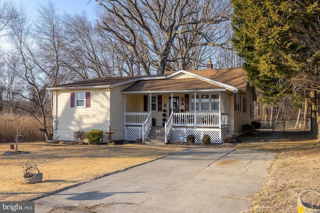 view of front of home with covered porch and a chimney