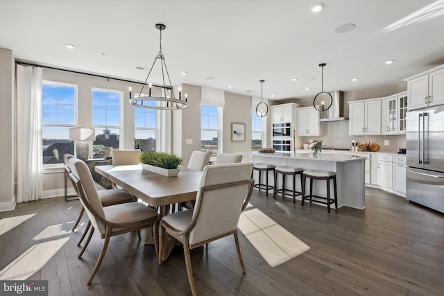 dining room featuring dark wood-type flooring and recessed lighting