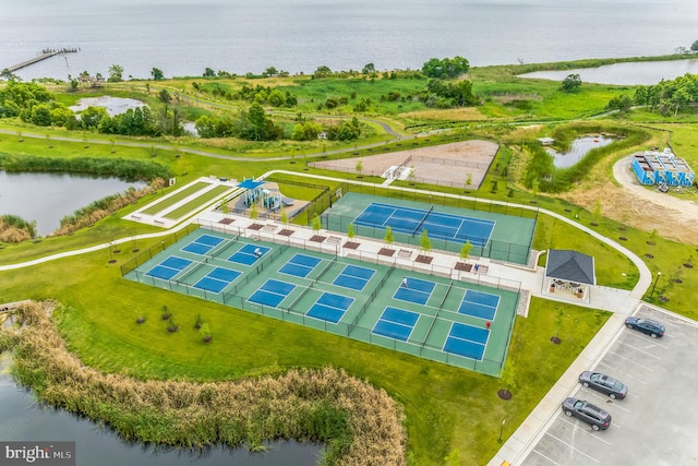 birds eye view of property with a water view