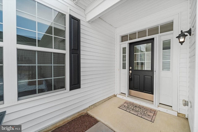 property entrance with covered porch