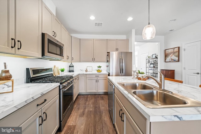 kitchen featuring recessed lighting, stainless steel appliances, a sink, visible vents, and dark wood-style floors