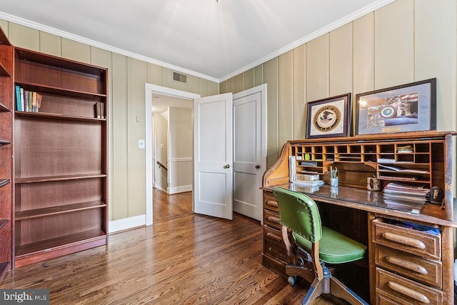 office space featuring visible vents, crown molding, baseboards, and wood finished floors