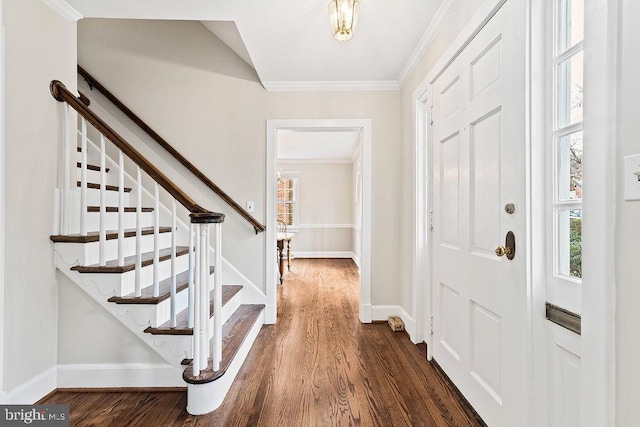 foyer with baseboards, dark wood-style floors, stairs, and ornamental molding