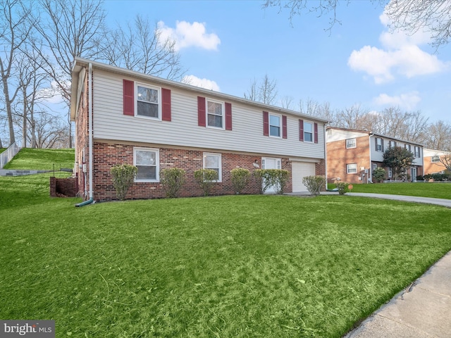 view of front facade featuring brick siding, a garage, and a front yard