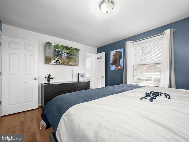 bedroom featuring wood finished floors