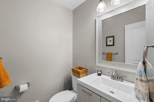 half bath with toilet and vanity