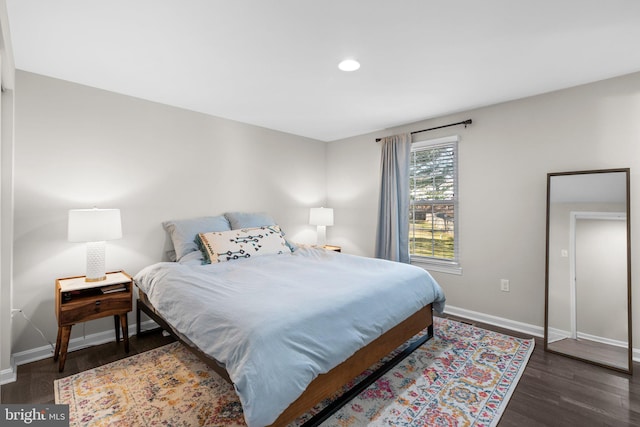 bedroom with recessed lighting, baseboards, and wood finished floors