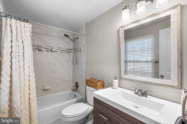 bathroom with toilet, vanity, and shower / tub combo