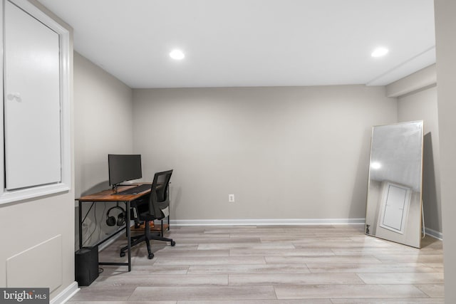 home office featuring recessed lighting, light wood-type flooring, and baseboards