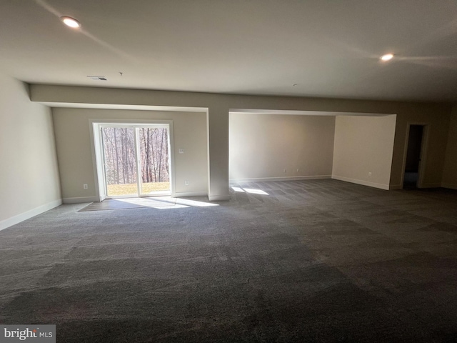 spare room with carpet, visible vents, baseboards, and recessed lighting