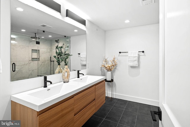 full bathroom with visible vents, a stall shower, and a sink