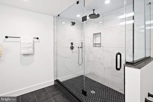 bathroom with tile patterned flooring, recessed lighting, a stall shower, and baseboards