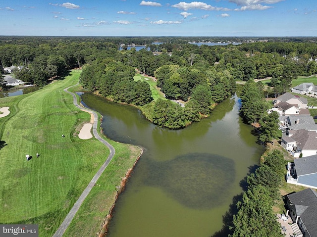 aerial view with a water view and a forest view