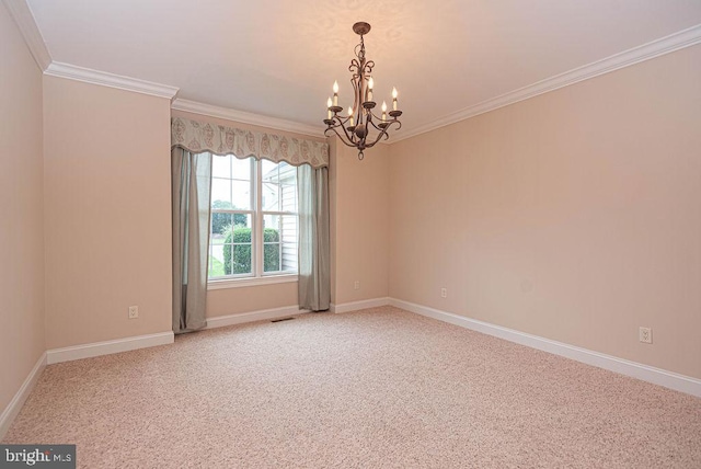 carpeted spare room with baseboards, visible vents, ornamental molding, and a notable chandelier