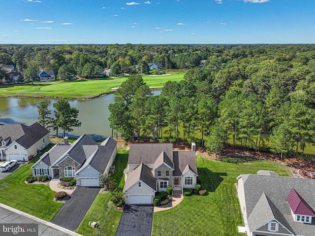 birds eye view of property with a water view, a forest view, and a residential view