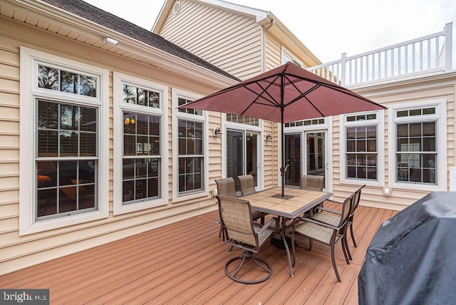 wooden deck with outdoor dining area