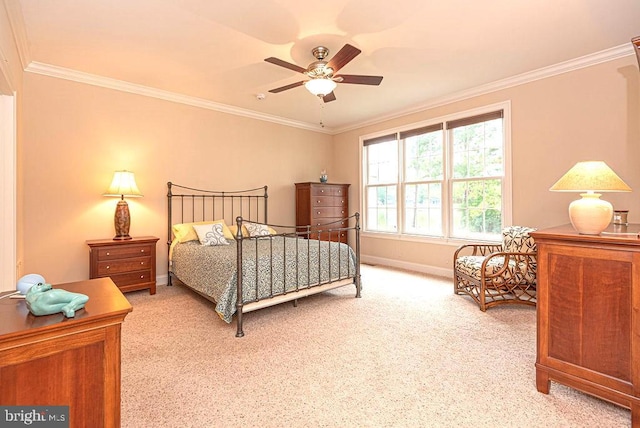 bedroom featuring light carpet, baseboards, ornamental molding, and ceiling fan