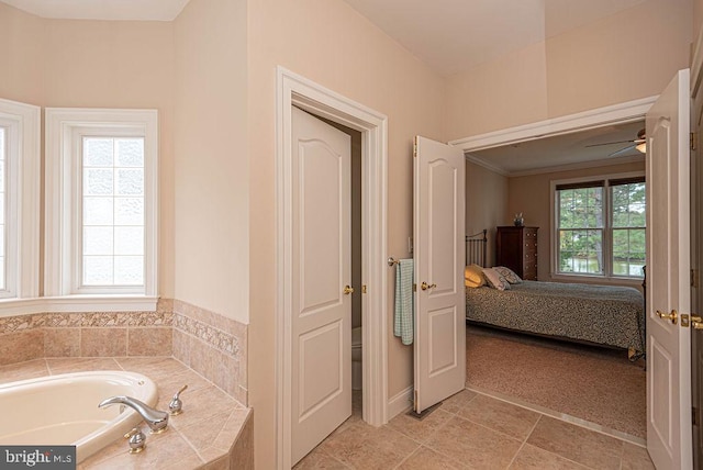 bathroom featuring a garden tub, tile patterned flooring, ceiling fan, and connected bathroom