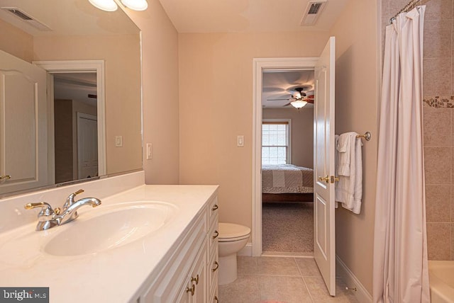 bathroom featuring tile patterned flooring, visible vents, vanity, and toilet