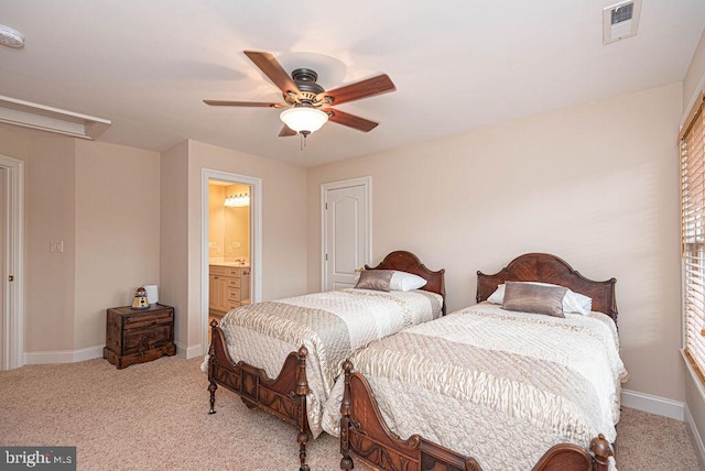 bedroom with attic access, visible vents, baseboards, a ceiling fan, and light colored carpet