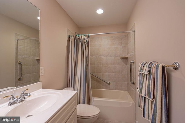 bathroom with shower / bath combination with curtain, vanity, and toilet