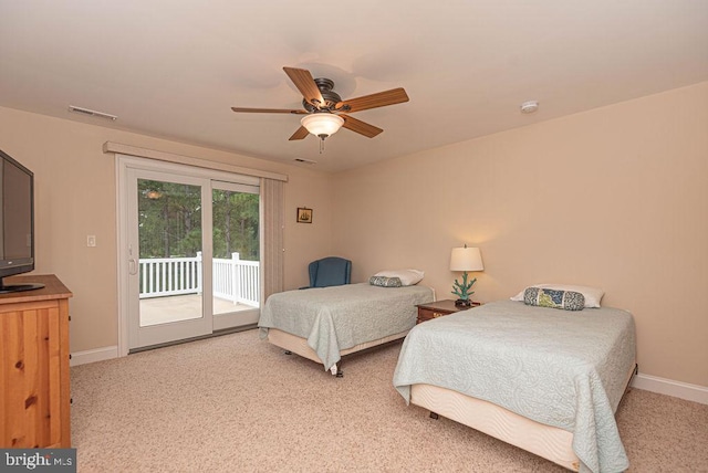 bedroom featuring light carpet, baseboards, a ceiling fan, and access to exterior