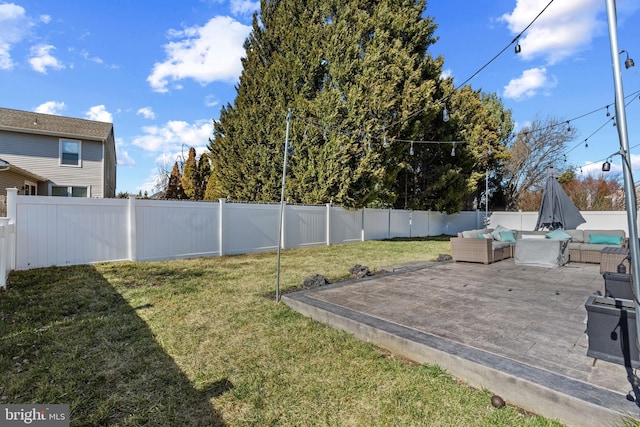 view of yard with outdoor lounge area, a patio, and a fenced backyard