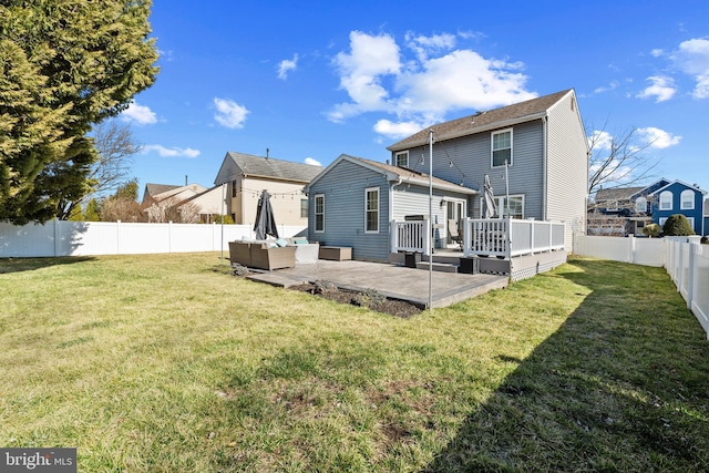 back of property featuring a yard, an outdoor hangout area, a patio area, a deck, and a fenced backyard