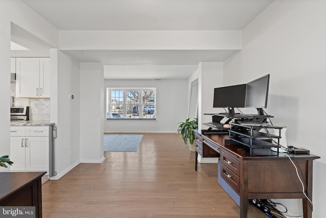 office with light wood finished floors and baseboards