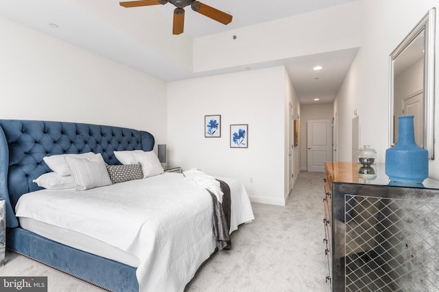 bedroom with a ceiling fan, recessed lighting, light colored carpet, and baseboards