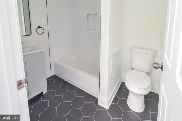 bathroom with visible vents, vanity, toilet, and tile patterned floors