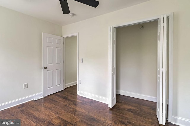 unfurnished bedroom with ceiling fan, baseboards, and wood finished floors