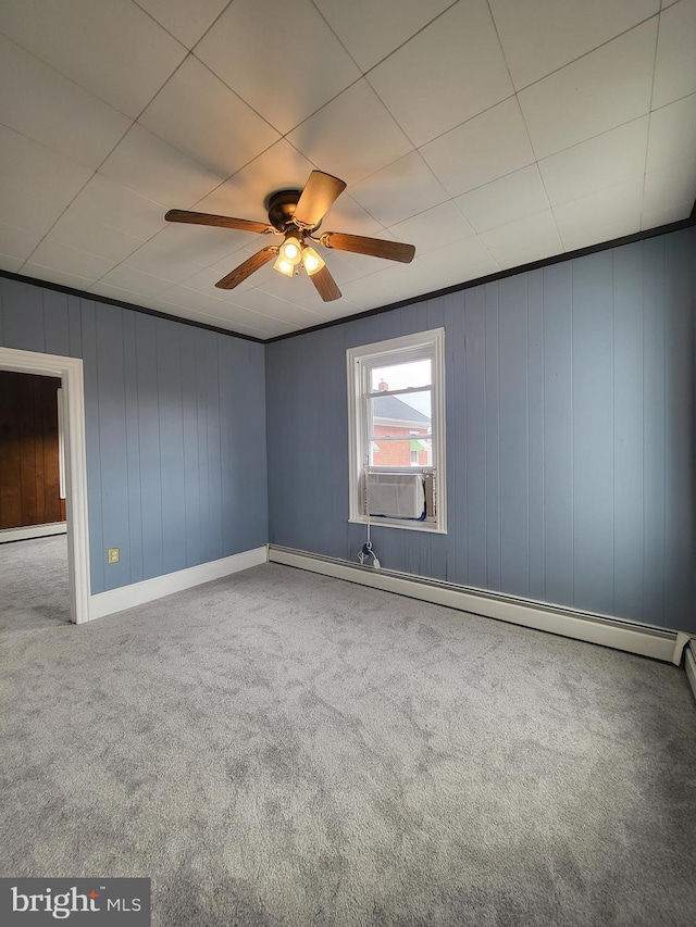 carpeted empty room featuring a baseboard radiator, cooling unit, and a ceiling fan