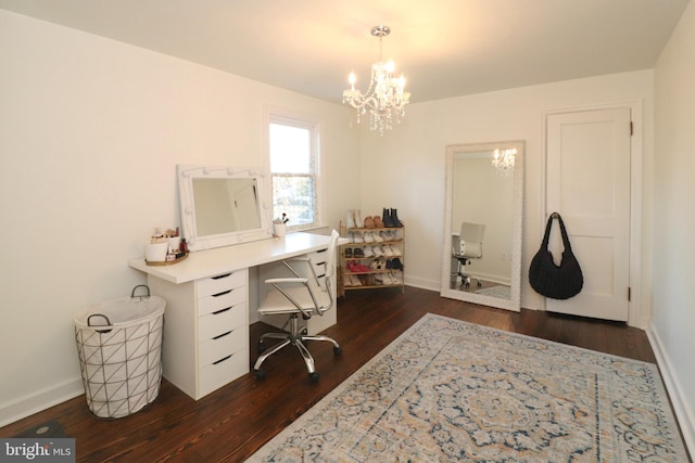 office space with baseboards, dark wood-style flooring, and a notable chandelier