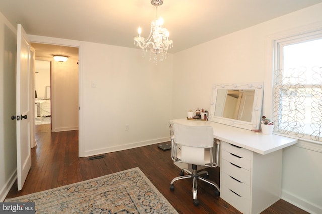 office featuring a notable chandelier, dark wood-style flooring, and baseboards