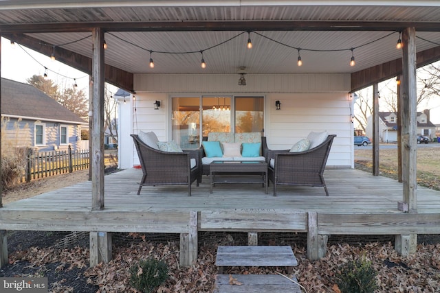 wooden terrace featuring an outdoor living space