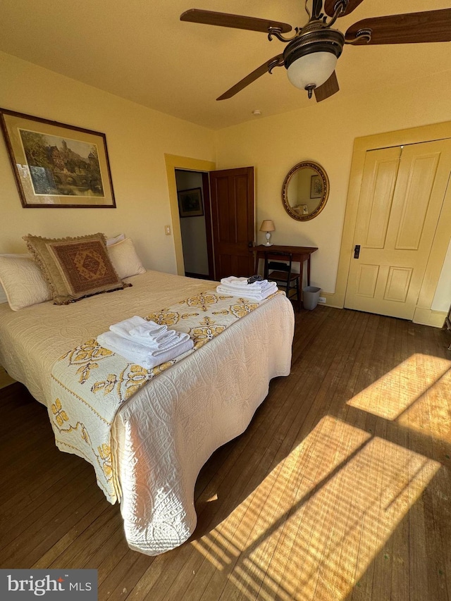 bedroom featuring wood-type flooring and ceiling fan