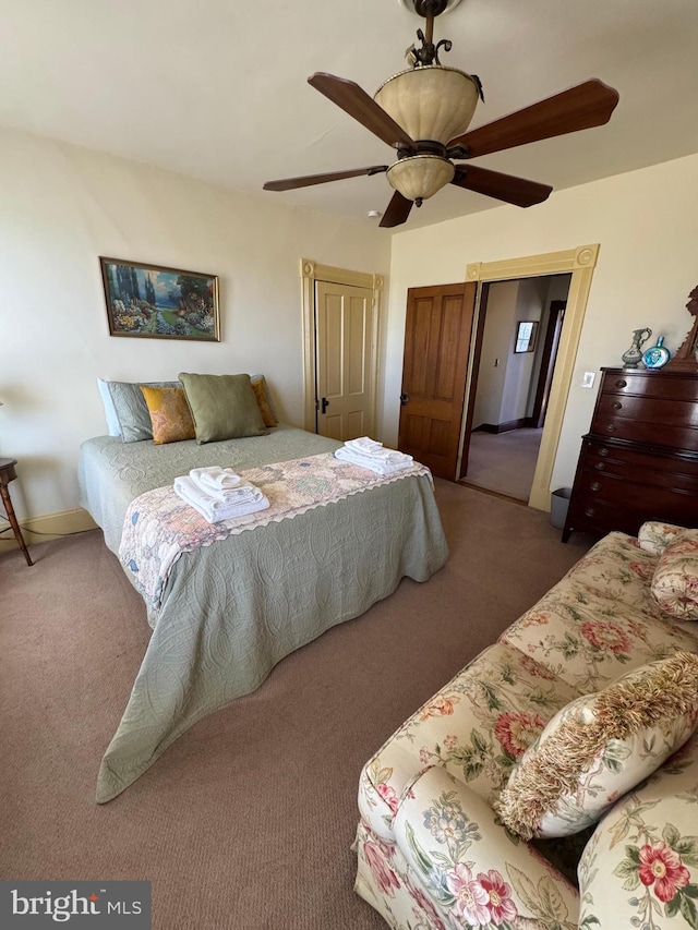 carpeted bedroom featuring a ceiling fan