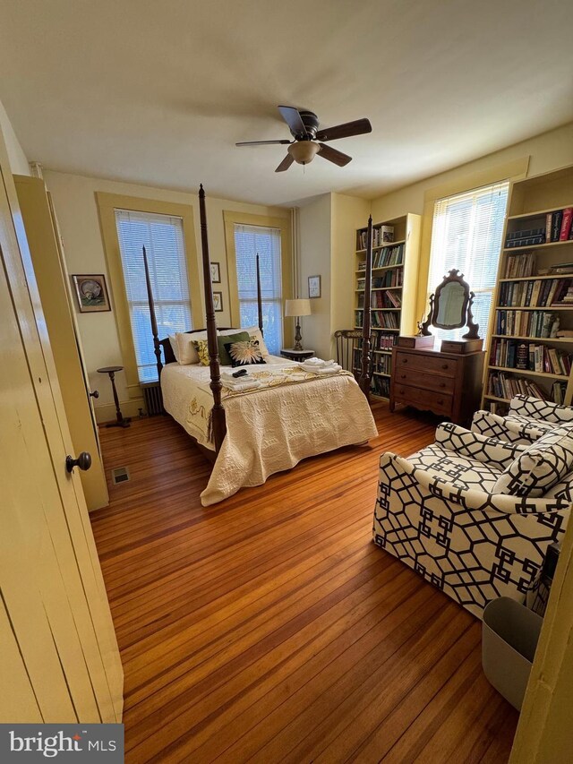 bedroom featuring a ceiling fan and wood finished floors