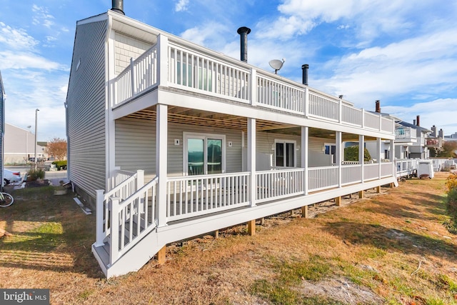 rear view of property featuring a porch