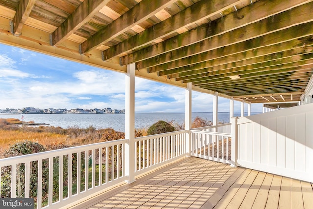 wooden terrace with a water view