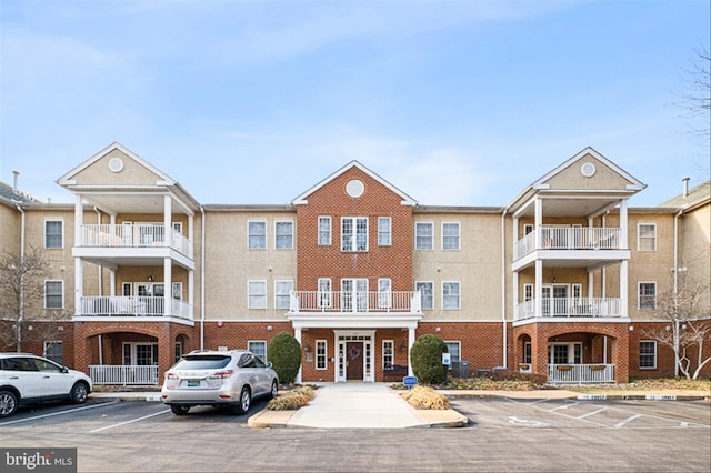 view of property with uncovered parking