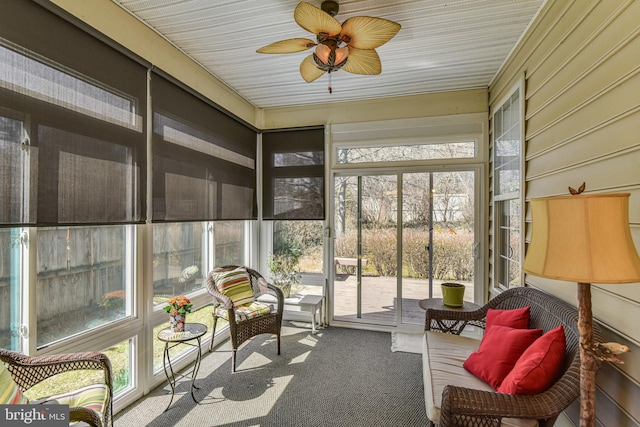 sunroom with a ceiling fan