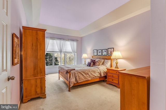 bedroom with light colored carpet