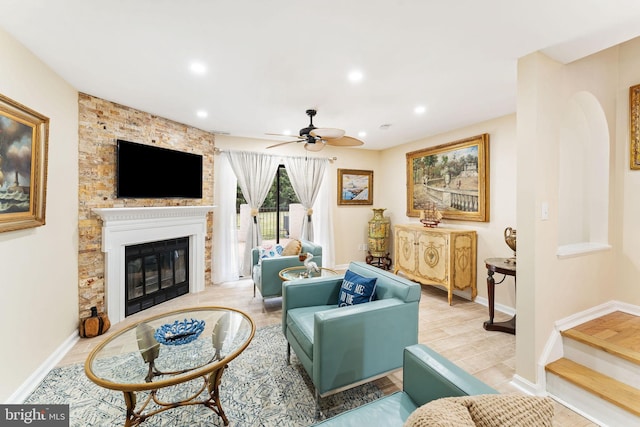 living room featuring recessed lighting, a large fireplace, ceiling fan, wood finished floors, and baseboards