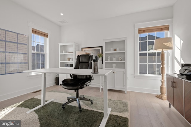 office space with recessed lighting, baseboards, and light wood finished floors